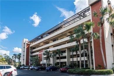 This spacious 2-bedroom, 2.5-bathroom residence with a den on Club at Pelican Bay Golf Course in Florida - for sale on GolfHomes.com, golf home, golf lot