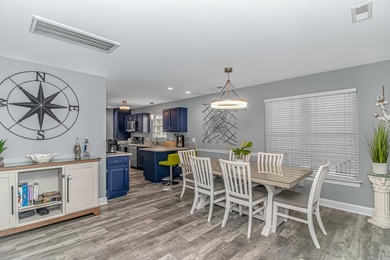 This very open and spacious 5 Bedroom, 4.5 Bath raised beach on Prestwick Country Club in South Carolina - for sale on GolfHomes.com, golf home, golf lot