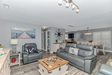 This very open and spacious 5 Bedroom, 4.5 Bath raised beach on Prestwick Country Club in South Carolina - for sale on GolfHomes.com, golf home, golf lot