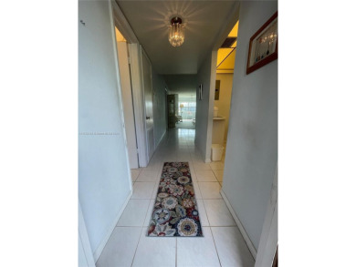 Lovely and well maintained, extended FIRST FLOOR 1/1.5 unit with on Sunrise Lakes Phase III in Florida - for sale on GolfHomes.com, golf home, golf lot