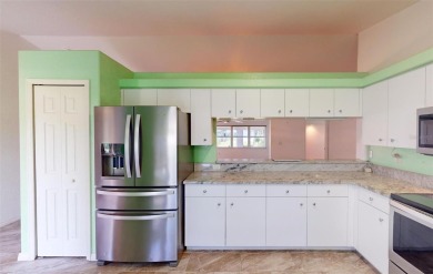 Featuring a rare 3 CAR GARAGE, this newer construction 3-bedroom on Oyster Creek Golf Club in Florida - for sale on GolfHomes.com, golf home, golf lot