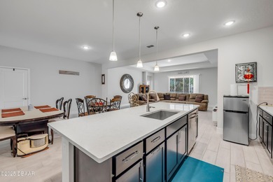 Discover this 4-bed, 3-bath home in Halifax Plantation with 2 on Halifax Plantation Golf Club in Florida - for sale on GolfHomes.com, golf home, golf lot