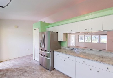 Featuring a rare 3 CAR GARAGE, this newer construction 3-bedroom on Oyster Creek Golf Club in Florida - for sale on GolfHomes.com, golf home, golf lot