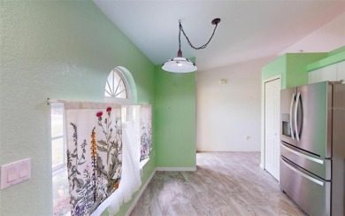 Featuring a rare 3 CAR GARAGE, this newer construction 3-bedroom on Oyster Creek Golf Club in Florida - for sale on GolfHomes.com, golf home, golf lot