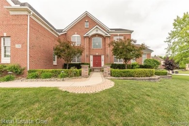 This stunning North-West facing colonial home, featuring 4 on The Inn At St. Johns Golf Course - Mark in Michigan - for sale on GolfHomes.com, golf home, golf lot