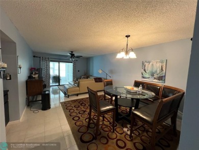 ALL AGES..E SEE IT RIGHT NOW...FIRST FLOOR END CORNER UNIT on Boca Dunes Golf and Country Club in Florida - for sale on GolfHomes.com, golf home, golf lot