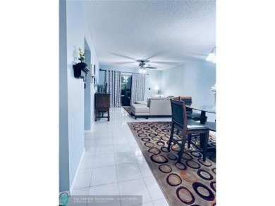 ALL AGES..E SEE IT RIGHT NOW...FIRST FLOOR END CORNER UNIT on Boca Dunes Golf and Country Club in Florida - for sale on GolfHomes.com, golf home, golf lot