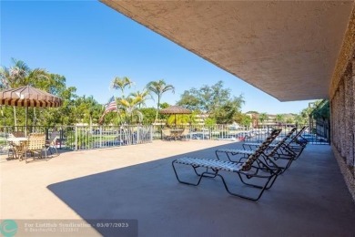 ALL AGES..E SEE IT RIGHT NOW...FIRST FLOOR END CORNER UNIT on Boca Dunes Golf and Country Club in Florida - for sale on GolfHomes.com, golf home, golf lot