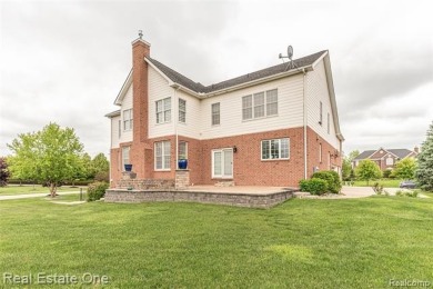 This stunning North-West facing colonial home, featuring 4 on The Inn At St. Johns Golf Course - Mark in Michigan - for sale on GolfHomes.com, golf home, golf lot
