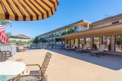 ALL AGES..E SEE IT RIGHT NOW...FIRST FLOOR END CORNER UNIT on Boca Dunes Golf and Country Club in Florida - for sale on GolfHomes.com, golf home, golf lot
