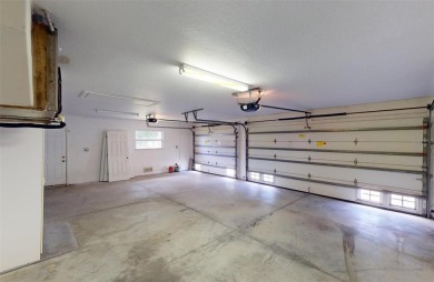 Featuring a rare 3 CAR GARAGE, this newer construction 3-bedroom on Oyster Creek Golf Club in Florida - for sale on GolfHomes.com, golf home, golf lot