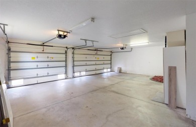 Featuring a rare 3 CAR GARAGE, this newer construction 3-bedroom on Oyster Creek Golf Club in Florida - for sale on GolfHomes.com, golf home, golf lot