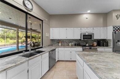 Welcome to your private oasis in Country Club Estates! Tucked on St. Lucie Trail Golf Club in Florida - for sale on GolfHomes.com, golf home, golf lot
