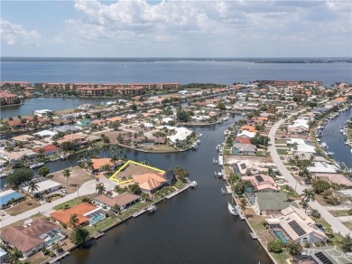 LARGER THAN AVERAGE KEY LOT IN PUNTA GORDA ISLES W/***162FT OF on Saint Andrews South Golf Club in Florida - for sale on GolfHomes.com, golf home, golf lot