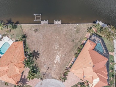 LARGER THAN AVERAGE KEY LOT IN PUNTA GORDA ISLES W/***162FT OF on Saint Andrews South Golf Club in Florida - for sale on GolfHomes.com, golf home, golf lot