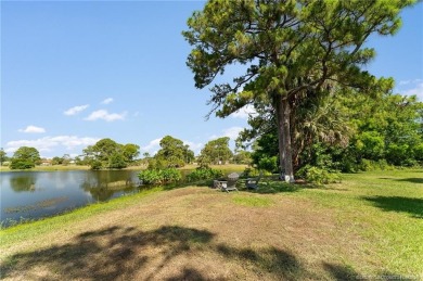Welcome to your private oasis in Country Club Estates! Tucked on St. Lucie Trail Golf Club in Florida - for sale on GolfHomes.com, golf home, golf lot