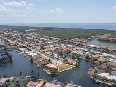 LARGER THAN AVERAGE KEY LOT IN PUNTA GORDA ISLES W/***162FT OF on Saint Andrews South Golf Club in Florida - for sale on GolfHomes.com, golf home, golf lot
