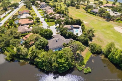 Welcome to your private oasis in Country Club Estates! Tucked on St. Lucie Trail Golf Club in Florida - for sale on GolfHomes.com, golf home, golf lot
