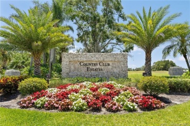 Welcome to your private oasis in Country Club Estates! Tucked on St. Lucie Trail Golf Club in Florida - for sale on GolfHomes.com, golf home, golf lot