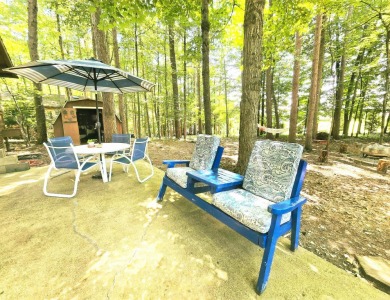 Welcome home to this wonderful 2 bedroom, 1 bath cabin in on Hide-A-Way Hills Golf Club in Ohio - for sale on GolfHomes.com, golf home, golf lot