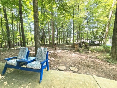 Welcome home to this wonderful 2 bedroom, 1 bath cabin in on Hide-A-Way Hills Golf Club in Ohio - for sale on GolfHomes.com, golf home, golf lot