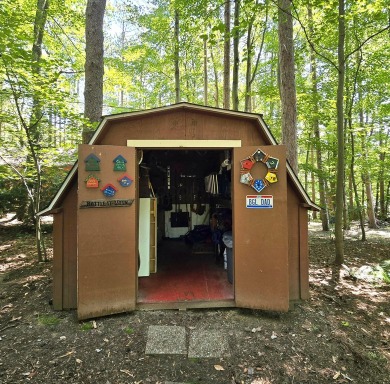 Welcome home to this wonderful 2 bedroom, 1 bath cabin in on Hide-A-Way Hills Golf Club in Ohio - for sale on GolfHomes.com, golf home, golf lot
