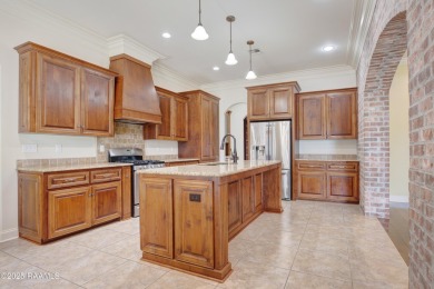 Showstopping two-story home on the pond in Squirrel Run! This on Squirrel Run Golf Courses in Louisiana - for sale on GolfHomes.com, golf home, golf lot