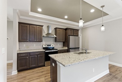 Built in 2023 and backing to the 10th green at Cherry Blossom on Cherry Blossom Golf and Country Club in Kentucky - for sale on GolfHomes.com, golf home, golf lot