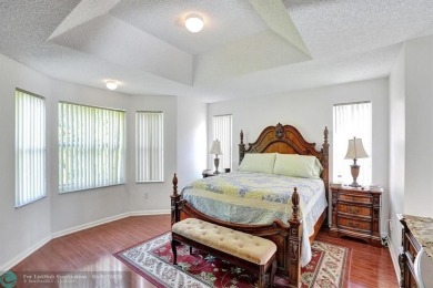Lowest price, very well maintained 4 bed 2.5 bath in the highly on The Links At Madison Green in Florida - for sale on GolfHomes.com, golf home, golf lot