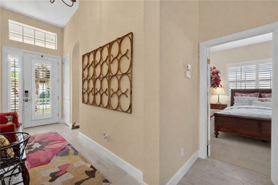 Enjoy peaceful lakefront living in this popular Heron model on Crown Colony Golf and Country Club in Florida - for sale on GolfHomes.com, golf home, golf lot