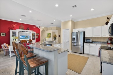 Enjoy peaceful lakefront living in this popular Heron model on Crown Colony Golf and Country Club in Florida - for sale on GolfHomes.com, golf home, golf lot