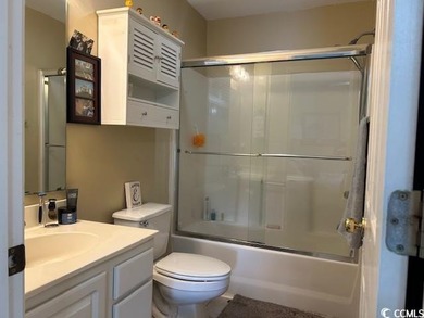 This corner unit golf course condo is tucked away in a serene on True Blue Plantation in South Carolina - for sale on GolfHomes.com, golf home, golf lot