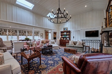 Nestled in the heart of High Hampton, this charming one-level on High Hampton Inn and Country Club in North Carolina - for sale on GolfHomes.com, golf home, golf lot