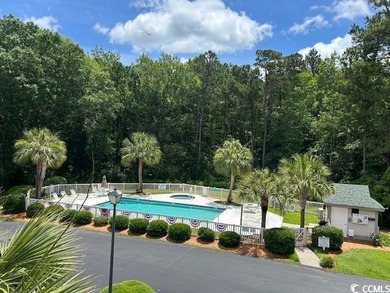 This corner unit golf course condo is tucked away in a serene on True Blue Plantation in South Carolina - for sale on GolfHomes.com, golf home, golf lot