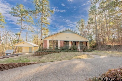 This comfortable home is nestled back in the pine trees on a on Hide-A-Way Lake Golf Course in Texas - for sale on GolfHomes.com, golf home, golf lot