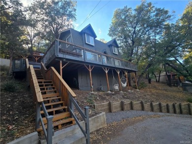 Tucked beneath majestic oaks and pines, this 3 bedroom, 2 bath on Big Bear Mountain Ski and Golf Resort in California - for sale on GolfHomes.com, golf home, golf lot