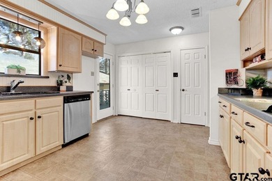 This comfortable home is nestled back in the pine trees on a on Hide-A-Way Lake Golf Course in Texas - for sale on GolfHomes.com, golf home, golf lot