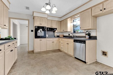 This comfortable home is nestled back in the pine trees on a on Hide-A-Way Lake Golf Course in Texas - for sale on GolfHomes.com, golf home, golf lot