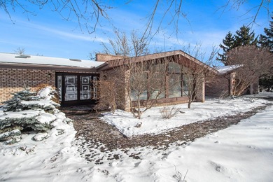 Sprawling brick ranch on a quiet culdesac overlooking the #11 on Travis Pointe Country Club in Michigan - for sale on GolfHomes.com, golf home, golf lot