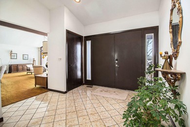 Sprawling brick ranch on a quiet culdesac overlooking the #11 on Travis Pointe Country Club in Michigan - for sale on GolfHomes.com, golf home, golf lot