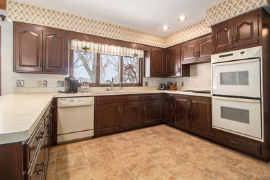 Sprawling brick ranch on a quiet culdesac overlooking the #11 on Travis Pointe Country Club in Michigan - for sale on GolfHomes.com, golf home, golf lot