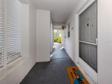 This first floor condo sits steps away from the community pool on Plantation Golf and Country Club in Florida - for sale on GolfHomes.com, golf home, golf lot