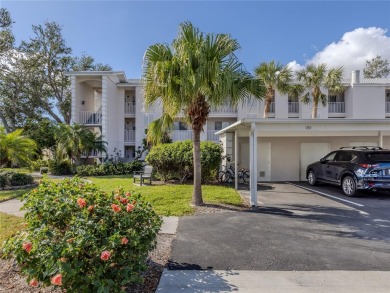 This first floor condo sits steps away from the community pool on Plantation Golf and Country Club in Florida - for sale on GolfHomes.com, golf home, golf lot