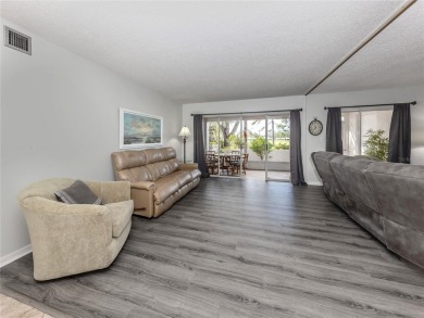 This first floor condo sits steps away from the community pool on Plantation Golf and Country Club in Florida - for sale on GolfHomes.com, golf home, golf lot