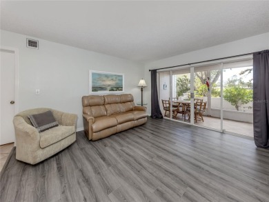 This first floor condo sits steps away from the community pool on Plantation Golf and Country Club in Florida - for sale on GolfHomes.com, golf home, golf lot