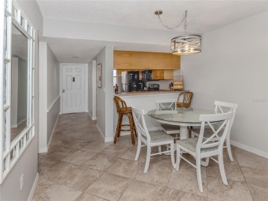 This first floor condo sits steps away from the community pool on Plantation Golf and Country Club in Florida - for sale on GolfHomes.com, golf home, golf lot