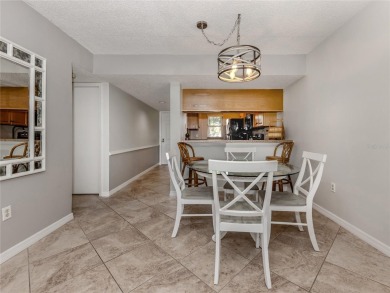 This first floor condo sits steps away from the community pool on Plantation Golf and Country Club in Florida - for sale on GolfHomes.com, golf home, golf lot