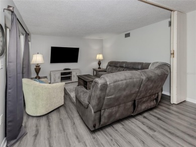This first floor condo sits steps away from the community pool on Plantation Golf and Country Club in Florida - for sale on GolfHomes.com, golf home, golf lot