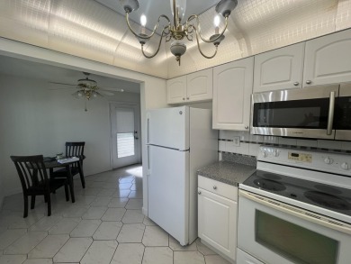 True corner ground floor end unit Burgundy 'F' bldg. Park right on Kings Point Golf -Flanders Way in Florida - for sale on GolfHomes.com, golf home, golf lot
