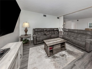 This first floor condo sits steps away from the community pool on Plantation Golf and Country Club in Florida - for sale on GolfHomes.com, golf home, golf lot